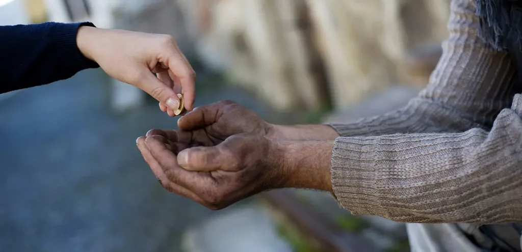 giving money to poor hero.jpg